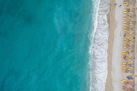 Straight down view on parasols and beach by Bunec Beach area in Summer 2022, Albaniaの写真素材