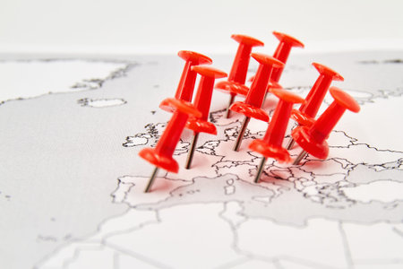 Map of Europe with red pushpins where is covid-19 epidemic. Concept of the spread of the virus.