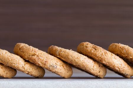 Several chocolate chip cookies on dark background. Close-upの写真素材