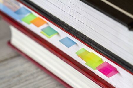 Book with colorful bookmarks or memory notesの写真素材