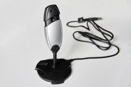 Removable web camera with USB cable on white background