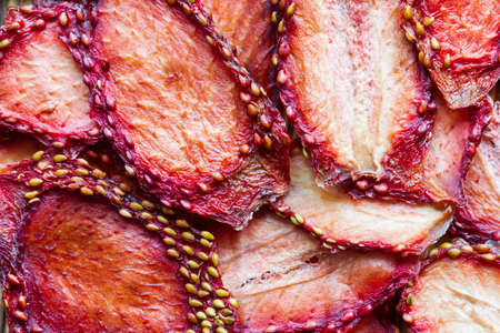 Background of dried sliced strawberries. Top view. Closeup.の写真素材