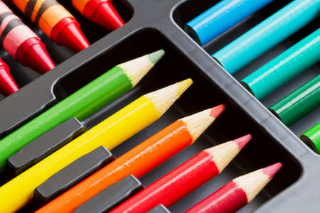A set of colorful pencils in the box. Closeup, selective focusの写真素材