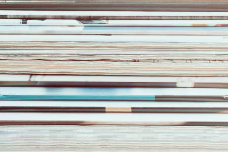 A stack of old magazines. Closeup, tonedの写真素材