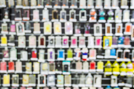 Blurred shop window with colorful phone cases.の写真素材