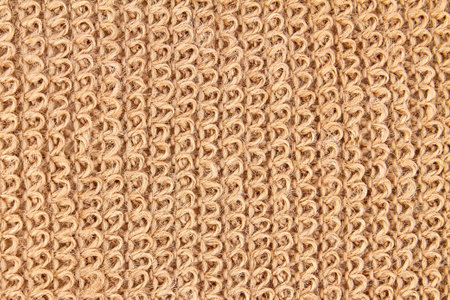 Background or texture of Natural eco-friendly Brown jute washcloth. Closeup
