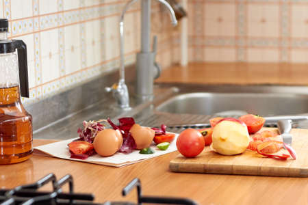 Food waste and offcuts while preparing food on the kitchen.の写真素材