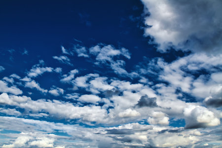 Cloudscape. Blue sky and gray clouds.
