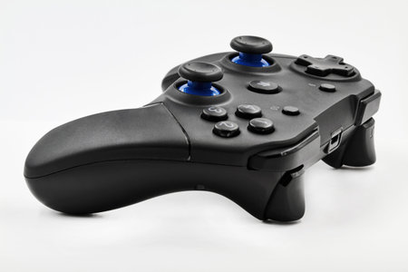 Gamepad on a white background. Game Joystick. Closeup, selective focus.