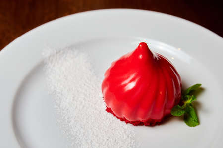 Red cake on a white plate. Close-up, selective focusの写真素材