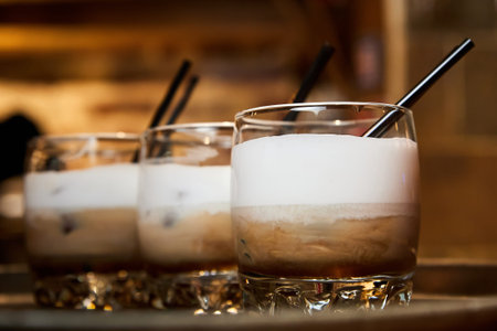 Iced coffee in transparent glass glasses. Close-up, selective focusの写真素材
