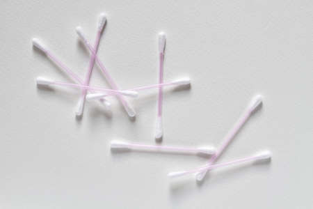 A group of ear swabs or cotton ear sticks on the light background. Ear care cjncept. Closeupの写真素材