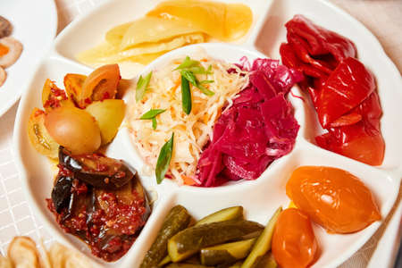 Set of pickled vegetables. Cabbage, tomatoes, cucumbers, peppersの写真素材