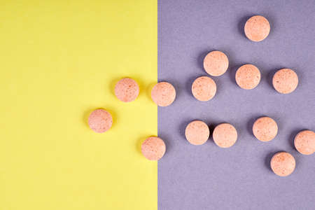 Orange pills on colorful backgroundの写真素材