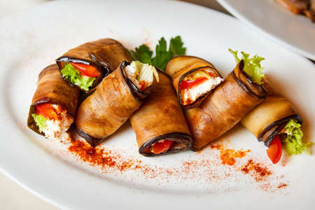 Eggplant rolls with cheese, tomatoes and lettuceの写真素材