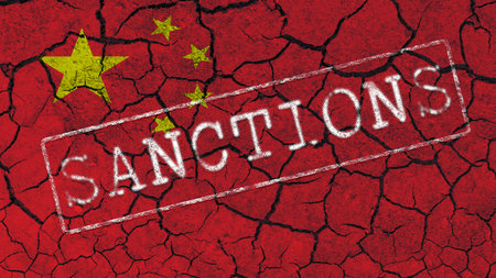 The inscription SANCTIONS on the background of the flag of China and cracksの写真素材