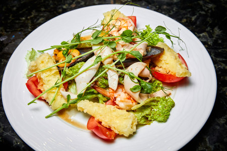 Mixed salad with seafood, tomato and Mozzarella cheeseの写真素材