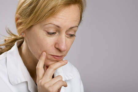Portrait of thoughtful woman looking into copy spaceの写真素材