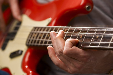 Close-up of bass player in action