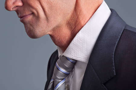 Close-up of businessman wearing white collar and tieの写真素材