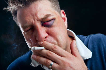 Portrait of hooligan smoking cigaretteの写真素材