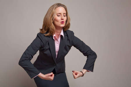 Business woman shows off her strengthの写真素材