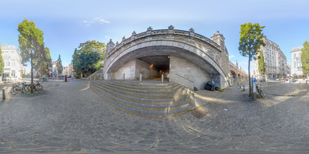 Panoramic view of a bridge, tunnel, and cobblestones.の写真素材