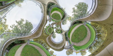 Aerial panoramic view of the roundabout in the park. Mathematical warp.