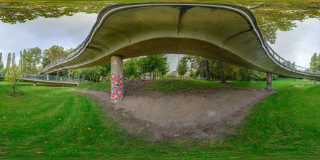 3D rendering of a bridge in a park with grass and trees.の写真素材