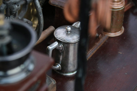 Old retro coffee pot and mill on wooden backgroundの写真素材