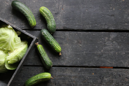 Cucumbers on a wooden surface. Raw Organic food.の写真素材
