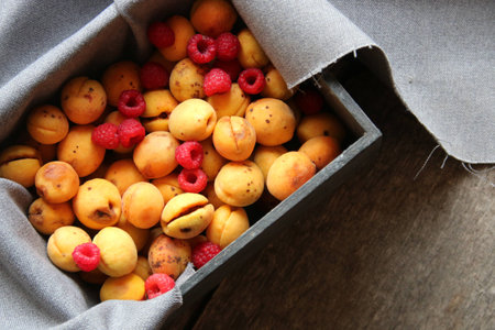 red sweet ripe Raspberry in wooden boxの写真素材