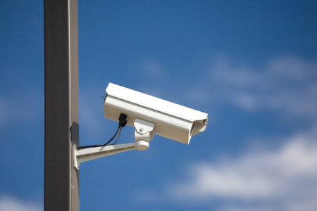 surveillance camera on light pole in parking lot