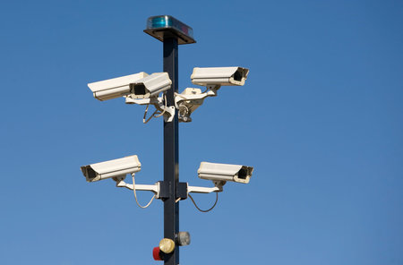 Cluster of security cameras at entrance to secure area.