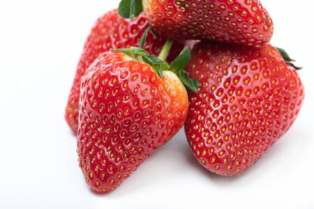ripe strawberries on a white backgroundの写真素材