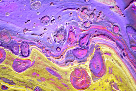 Spread-out acrylic paint. Abstract background, made in the technique of fluid art. Fashionable colorful background in warm colorsの写真素材