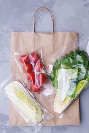 A set for delivering food for dinner on a gray background. I cook at home.の写真素材