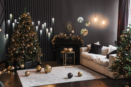 Tver, Russia-November 10, 2021. Christmas interior with a beautiful Christmas tree, sofa, light bulbs and dark background.のeditorial素材