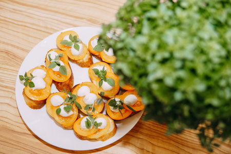 Bruschetta with tomatoes and cheese. Italian dish, cooking at a culinary master class. Cooking at home, home food.の写真素材