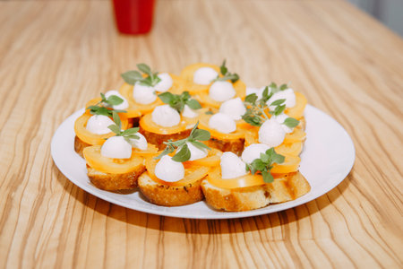 Bruschetta with tomatoes and cheese. Italian dish, cooking at a culinary master class. Cooking at home, home food.の写真素材