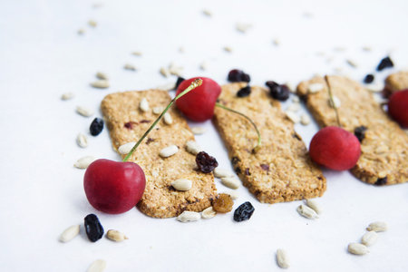 Granola cookies with raisins, cherries and seeds. Healthy sweet dessert. Healthy and healthy food....