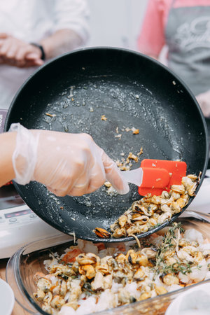 Cooking Sarsuella in the mater cooking class. Seafood dish close-up. homemade food.の写真素材