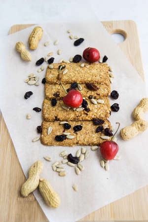 Granola cookies with raisins, cherries and seeds. Healthy sweet dessert. Healthy and healthy food. Homemade food, cooking at home.の写真素材