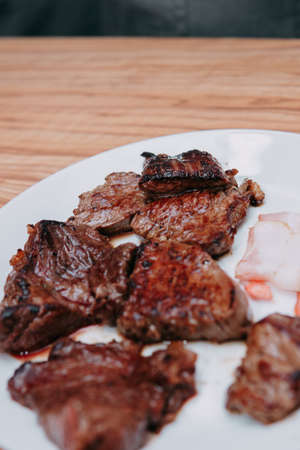 Raw beef meat for cooking steak. Raw beef is sliced, cooking meat for cooking steak in a cooking class.の写真素材