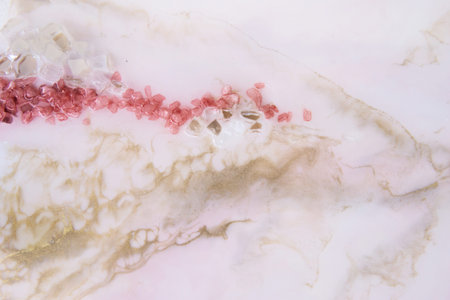 Artistic decoration made of golden resin. Epoxy resin paint, abstract background