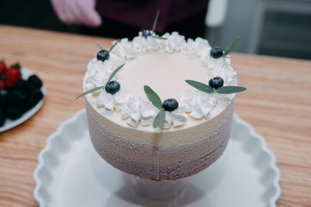 Preparation of mousse cake at a culinary master class. The pastry chef cooks at home. Homemade food...