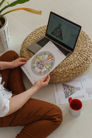 Tver, Russia-august 7, 2022. A woman with a laptop is studying human design. The concept of studying...