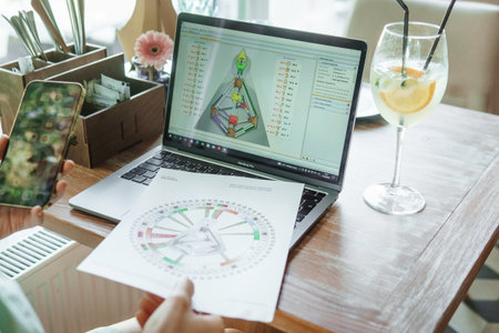 Tver, Russia-august 7, 2022. A woman with a laptop is studying human design. The concept of studying esoteric sciences. Studying rave postcards from human designのeditorial素材