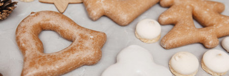 Banner for Christmas and New Year gingerbread stars, houses, Christmas trees, toys on a gray...