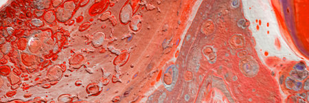 Spread-out acrylic paint. Abstract background, made in the technique of fluid art. Fashionable colorful background in warm colorsの写真素材